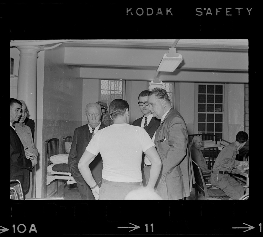 Albert DeSalvo talking to Paul A. Tamburello and other unidentified members of fact-finding delegation at Bridgewater State Hospital