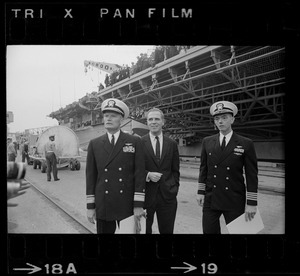 Rear Admiral Percival Jackson, Massachusetts Secretary of State Kevin White, and Captain Melvin Etheridge on dock next to USS Wasp