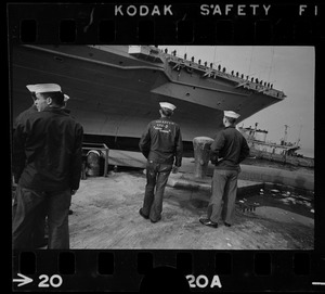 Sailors on dock next to USS Wasp