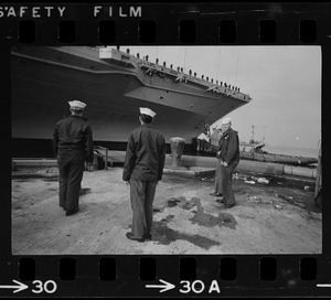 Sailors on dock next to USS Wasp