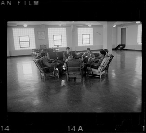 Men sitting in a circle at Portsmouth Naval Prison