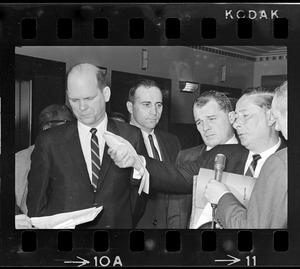 John Asgeirsson, Robert Barton, F. Lee Bailey, and Paul Smith being interviewed by reporters outside Massachusetts Supreme Court chambers after hearing about the Boston Strangler