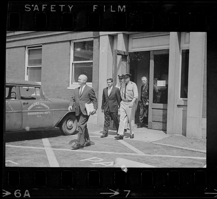 Court officers lead Albert H. DeSalvo of Malden from Middlesex Superior Court after he pleaded innocent to attack charges