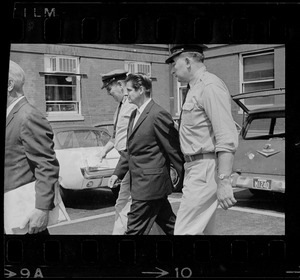 Court officers lead Albert H. DeSalvo of Malden from Middlesex Superior Court after he pleaded innocent to attack charges