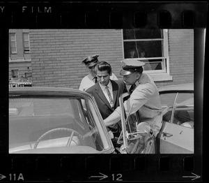 Court officers lead Albert H. DeSalvo of Malden from Middlesex Superior Court after he pleaded innocent to attack charges