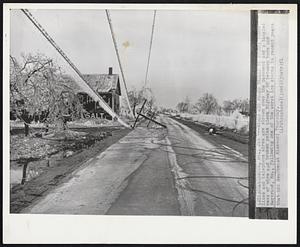 Wires and Poles Broken by Storm: Power lines and telephone wires are strewn over the pavement and a tangled mess of wire and broken poles block Highway 60 between here and Bertrand, Mo., following one of the worst ice storms in recent years that hit Southeast Missouri Thursday.