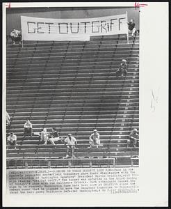 Someone up There Doesn't Like Him -- Fans in the sparsely populated centerfield bleachers show their displeasure with the administration of Washington Senators' President Calvin Griffith, with this sign reading "Get Out Griff." The banner was unfurled in the third inning of tonight's game with the Baltimore Orioles. Park attendants caused the sign to be removed. Washington fans have been sore at Griffith since the recent rumor that he planned to move the Senators franchise to Minneapolis. About the ball game; Baltimore defeated Washington, 4 to 3.