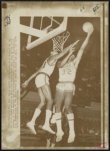 A Basket for Bridges--Bill Bridges of the St. Louis Hawks scores on this left handed hook shot late in the first quarter of play against the Philadelphia 76ers tonight in Philadelphia. Wilt Chamberlain of the 76ers tries in vain to block the shot.