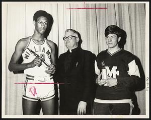 Catholic All-Stars-Bob Carrington (left) of Abp. Williams and Matignon's John Powers flank Msgr. Robert W. McNeill at awards presentation. Carrington and King Gaskins of Catholic Memorial were basketball repeaters, while Powers and John Ahern of CM were only two-time hockey selections.