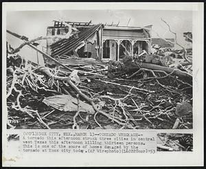 Tornado Wreckage-- A tornado this afternoon struck three cities in central West Texas this afternoon killing thirteen persons. This is one of the score of homes damaged by the tornado at Knox city today.