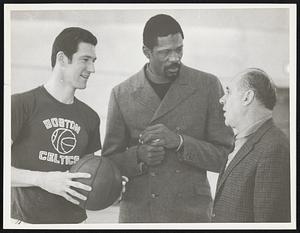 Bill Russell speaking with two unidentiifed men