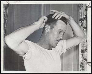 First Brave in Town for the city series opener today, Connie Ryan of the Braves spruces up for dinner last night at the Copley Plaza following his afternoon arrival.