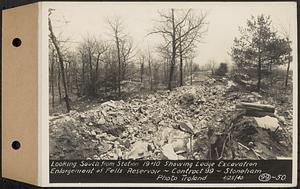 Contract No. 99, Enlargement of Fells High Level Distribution Reservoir, Stoneham, Malden, Melrose, looking south from Sta. 19+10 showing ledge excavation, enlargement of Fells Reservoir, Stoneham, Mass., Apr. 25, 1940