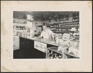 R. Mosher Swift in his package store