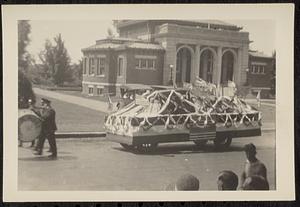 Parade passing Lawrence Library