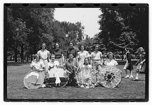 Group holding circular emblems