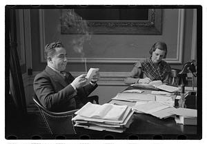 A man seated at a desk