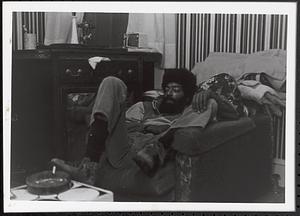 Man sitting on a sofa chair