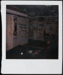 Young man playing pool in the basement