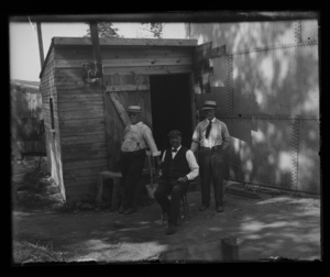 Singletree Hill Residence. Men in front of shed