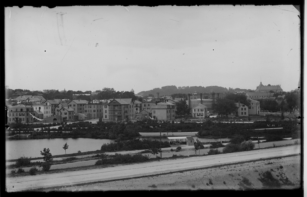 View of Brookline Village from Boston with pond and Pill Hill