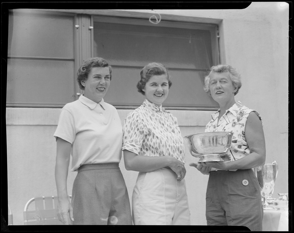State finals trophy presented to Pippy Rooney, center as Mrs. Donald McCluskey, left, looks on