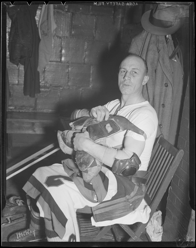 Eddie Shore in locker room at Garden