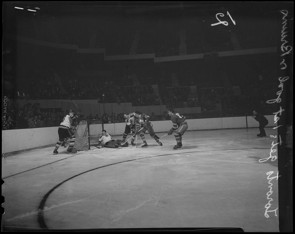 Ted Kennedy of the Maple Leafs (stick raised) scores first goal against Joe Klukay (defending) and Bruins goalie Jim Henry. Leafs won 3-1.
