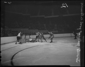 Ted Kennedy of the Maple Leafs (stick raised) scores first goal against Joe Klukay (defending) and Bruins goalie Jim Henry. Leafs won 3-1.