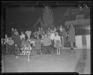 Santa and kids in front of the tree at the Bruins Christmas party, Boston Garden