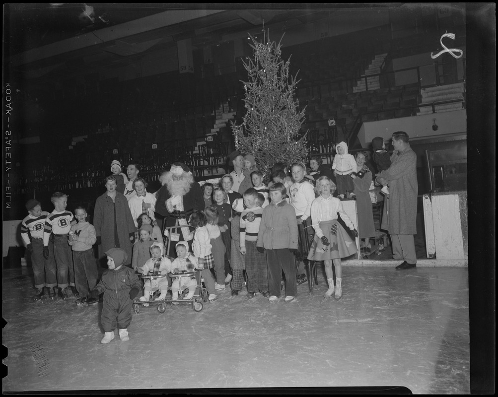 Santa Claus and children at Bruins Christmas party, Boston Garden