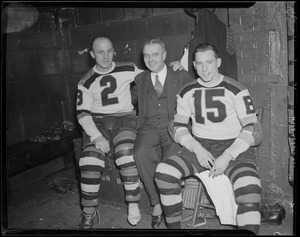 Eddie Shore, Dr. Martin Crotty and Milt Schmidt in Bruins locker room