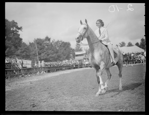 Woman riding in horse show