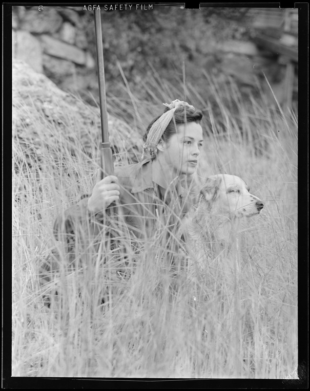 Woman, dog and gun, duck shooting