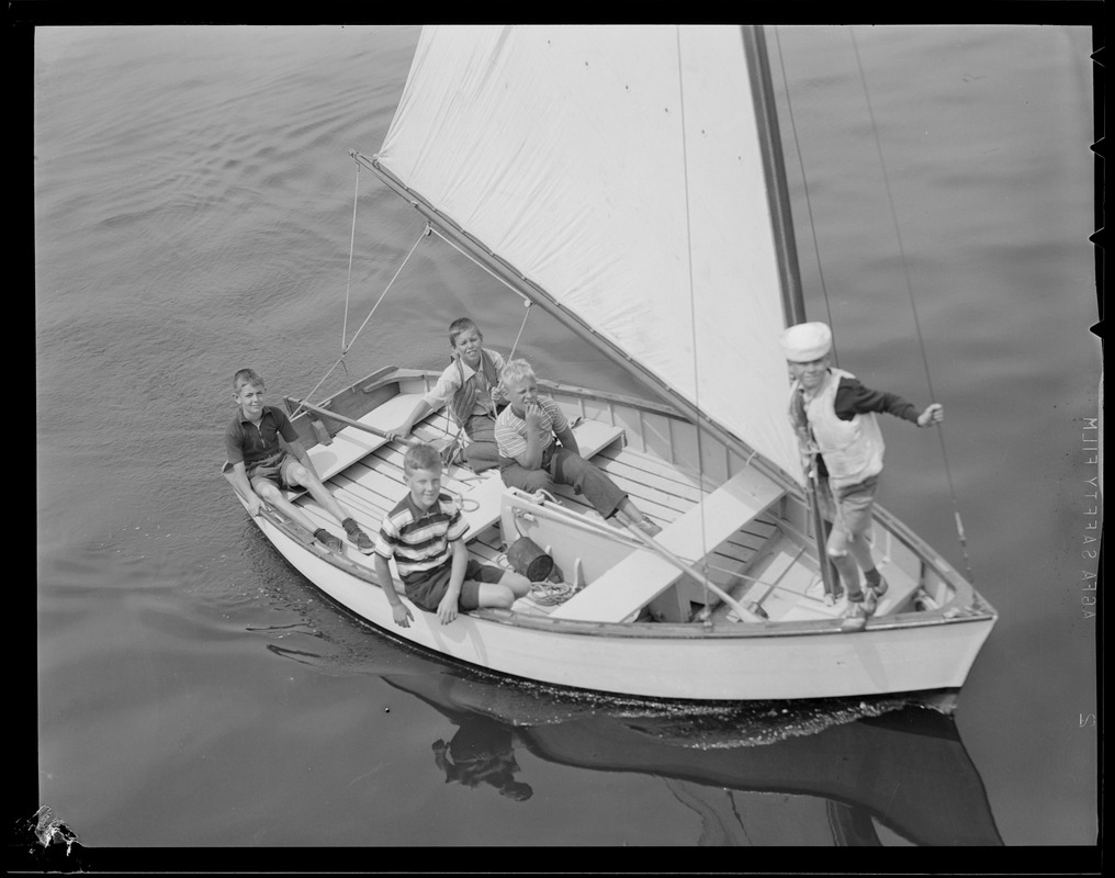 Boys in sail boat