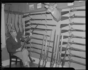 Hunter in his gun room