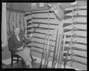 Hunter in his gun room