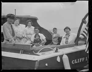 Family aboard motor boat