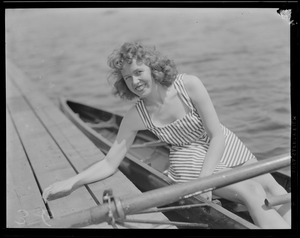 Girl oarsman in scull