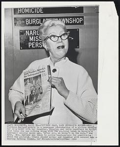 Pictures Okay, Says Beverly's Mother--Mrs. Florence Aadland points to a newspaper reproduction of a picture showing her in a brawl with her daughter, Beverly, and tells reporters in Hollywood today she saw nothing wrong with the pictures taken in Beverly's apartment several weeks ago. "After all, we weren't in the nude," she said. Mrs. Aadland was taken to police headquarters for questioning about the pictures. Others showed mother and daughter with several men wearing bathing trunks.