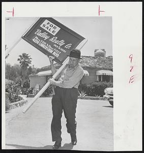 Straight Man Bud Abbott posts a for sale sign in front of his $125,000 home in Encino, Calif., in hopes of raising $75,000. The money will go to pay some of penalties, fines and interest slapped on him by Internal Revenue Service agents.