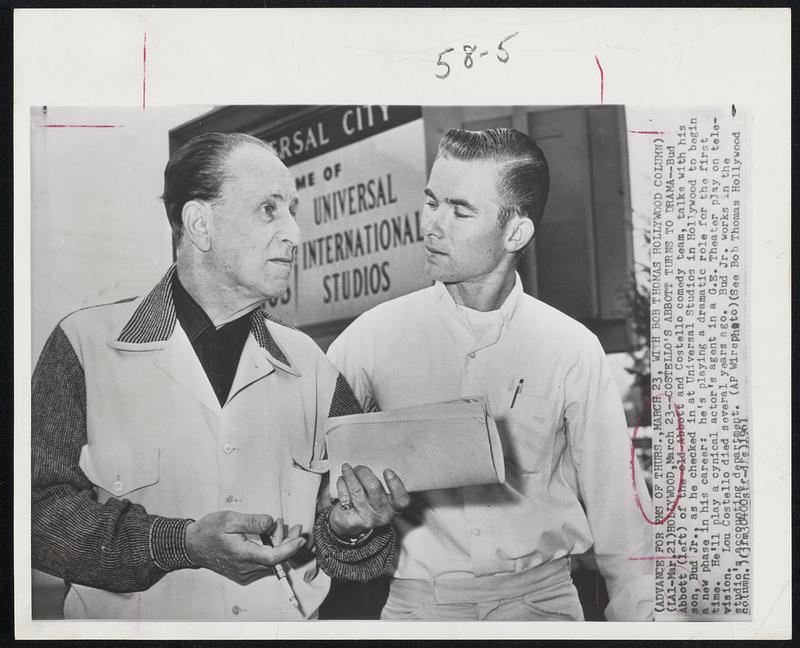 Costello's Abbott Turns To Drama - Bud Abbott (left) of the old Abbott and Costello comedy team, talks with his son, Bud Jr., as he checked in at Universal Studios in Hollywood to begin a new phase in his career: he's playing a dramatic role for the first time. He'll play a cynical actor's agent in a G.E. Theater play on television. Lou Costello died several years ago. Bud Jr. works in the studio's accounting department.