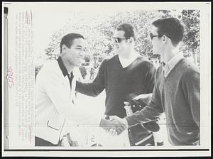 Heisman Trophy Winner Congratulated--O.J. Simpson (left) University of Southern California halfback who was named winner of the 1968 Heisman Trophy yesterday, is congratulated by teammates Bob Miller (center) and Mike Battle. It was reported that Simpson would be drafted-and retained-this winter by the Philadelphia Eagles.