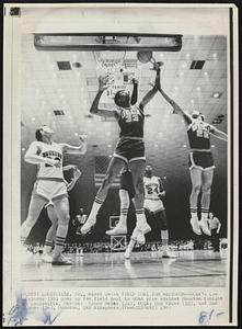 A Field Goal for Alcindor--UCLA's Lew Alcindor (33) goes up for field goal in NCAA play against Houston tonight at Louisville. Others: Kenny Heitz (22), UCLA; Don Kruse (22), and Don Chaney (24), Houston.