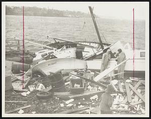 Graveyard and Junkyard - This stretch of Marblehead Harbor shoreline became a graveyard for a number of pleasure boats during the storm as well as a junkyard of timbers, oil drums, even a tire or two.