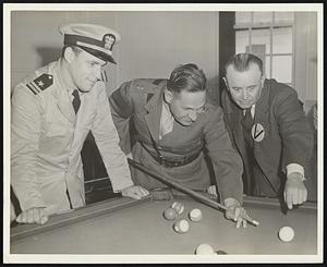 Left to Right: Lt. P. Caswell, U.S. Navy; Capt. Thos. Whitesel, U.S. Marine Corps; and Erwin Rudolph, Five Times World Champion Billiard Player gives an Exhibition of Pocket Billiards and Trick Shots before U.S.Marines at U.S. Marine Barracks, Hingham, Mass. under auspices of WPA War Mobile Recreation Unit and Billiard Ass’n of America. Rudolph shows Capt. Whitesel how to handle a difficult shot.