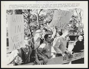 Hecklers at the Vietnam peace march here 10/16 give voice to their disagreement with opponents of U.S. military action in Vietnam. The peace march was disrupted by shouted insults, rotten eggs, red paint, and numerous short scuffles.