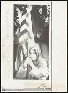 My Country, Right or Wrong? -- Much of this country's mood is in the concerned expression of Linda Tunstead, 19, of Whippany, N.J. She holds Old Glory at peace rally at County College of Norris, Randolph, N.J. Picture by Tim Manning of Morris County's Daily Record of Morristown, N.J.