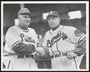 Managers Shake Hands Before Duel of their teams at Braves Field today in Boston's National League opener. On the left is Ed Sawyer of the Phillies exchanging five fingers in the grip with the Braves' Billy Southworth.