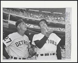 Washington -- Weather Check -- Detroit Manager Bob Scheffing and Washington Manager Mickey Vernon take a weather check from benefit of photographers before the start of today's opening game in the new District of Columbia stadium. The weather was cloudy and the forecast was possible showers.